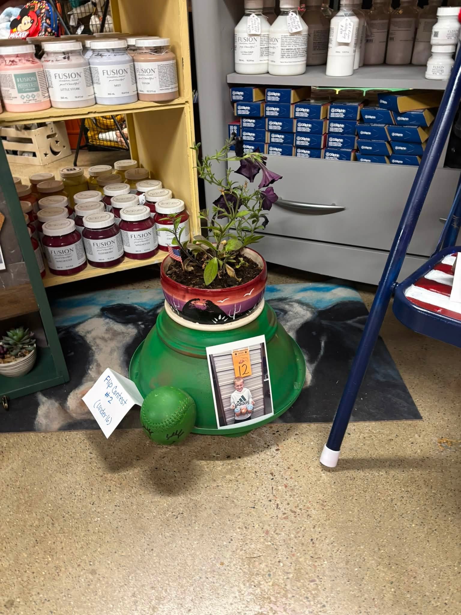 Archer Bergeleen's winning kids flip entry — a painted green planter with a flower and a baseball